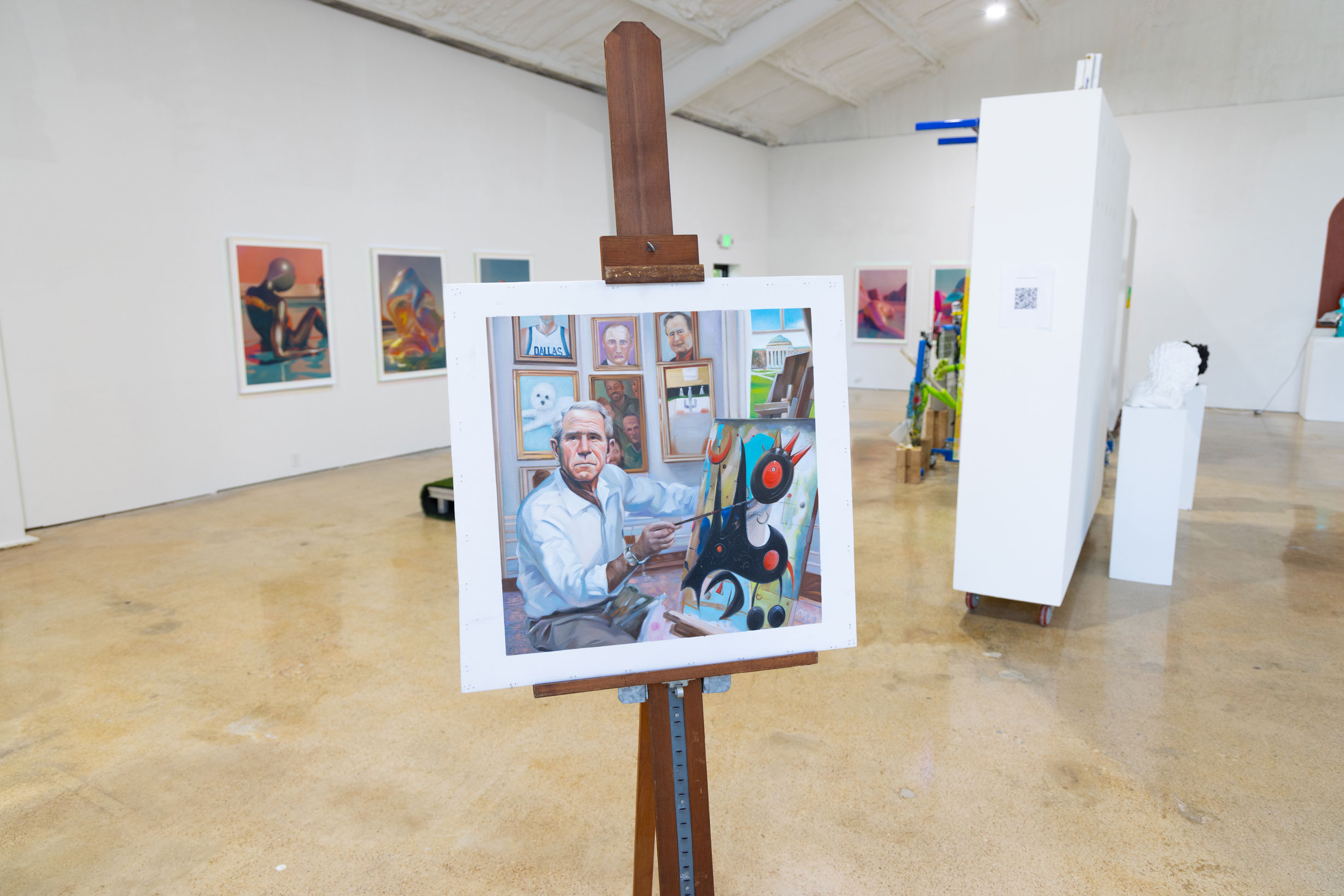 Painting displayed on easel in art gallery exhibition