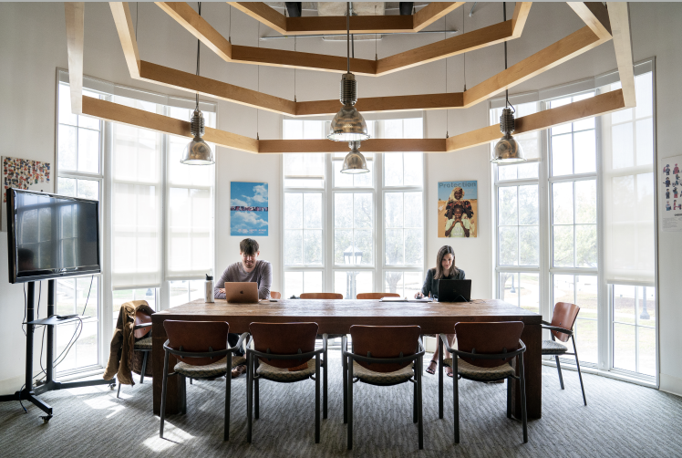 Two people sitting at a table in Hunt Institute 