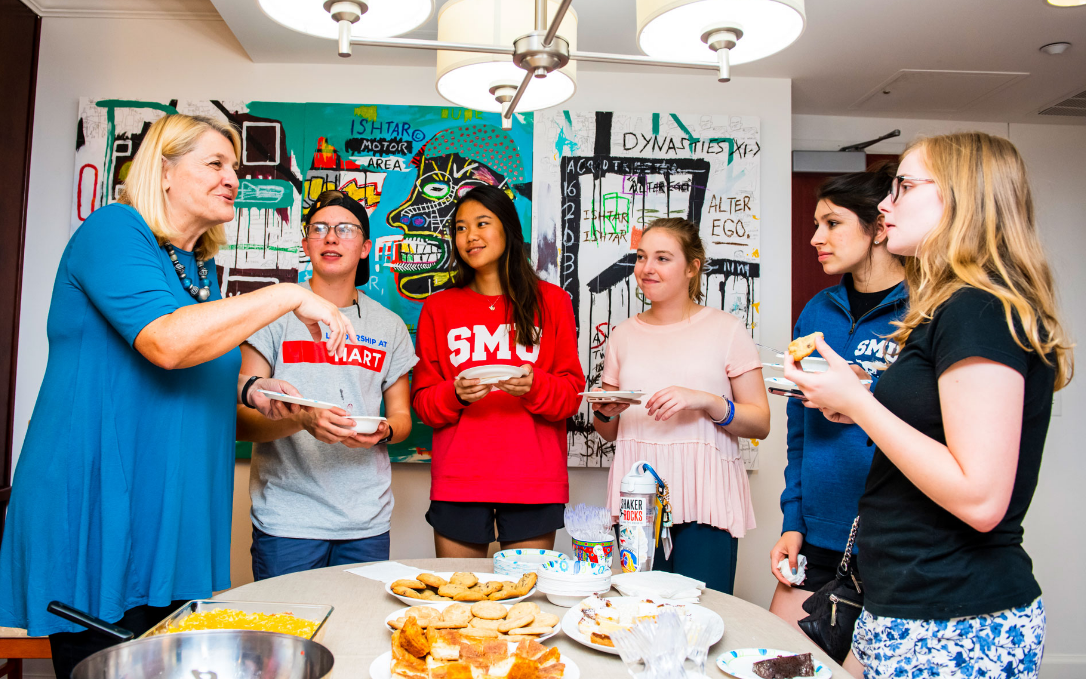 Faculty and students sharing a meal